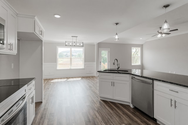 kitchen with ceiling fan, dark hardwood / wood-style flooring, sink, stainless steel appliances, and white cabinetry