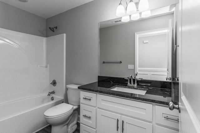 full bathroom with tub / shower combination, vanity, and toilet