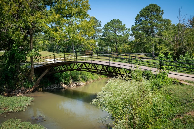 surrounding community with a water view