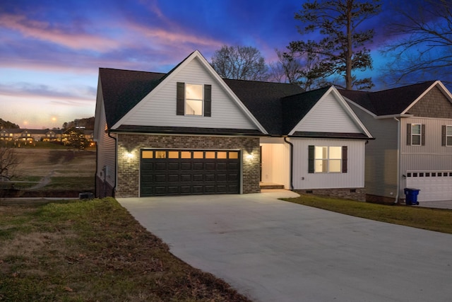 view of front of property with a garage