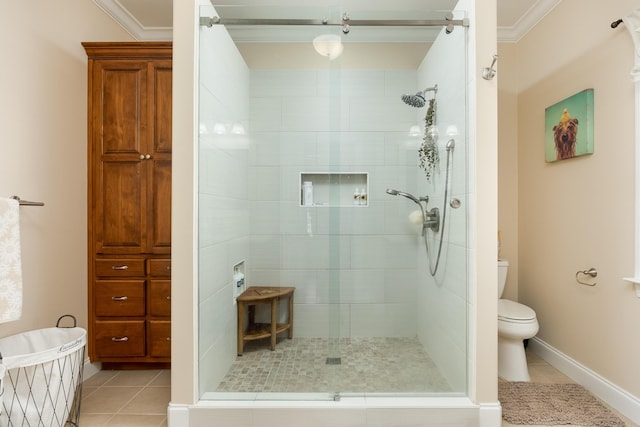 bathroom with crown molding, toilet, and an enclosed shower