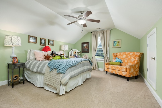 carpeted bedroom featuring lofted ceiling and ceiling fan