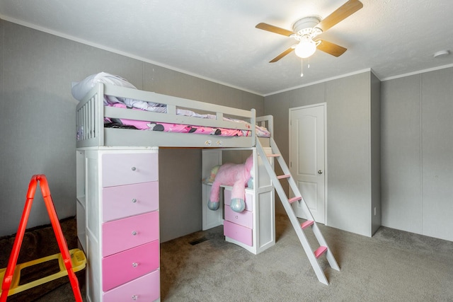 bedroom featuring visible vents, carpet floors, ornamental molding, and a ceiling fan