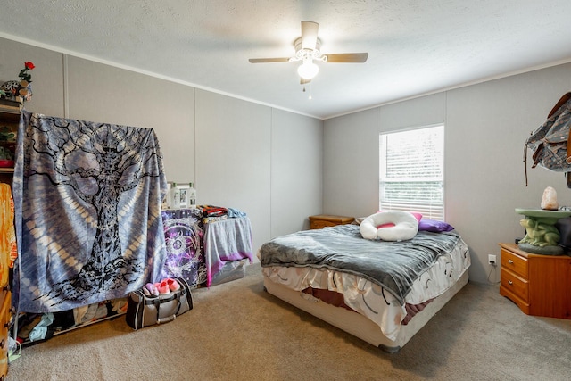 bedroom featuring a textured ceiling, carpet, and a ceiling fan