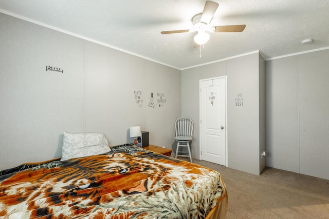 bedroom with a textured ceiling, carpet floors, a ceiling fan, and crown molding