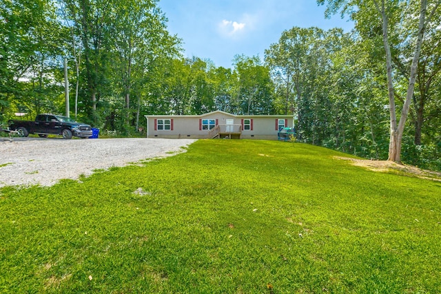view of front of house featuring a front lawn and crawl space