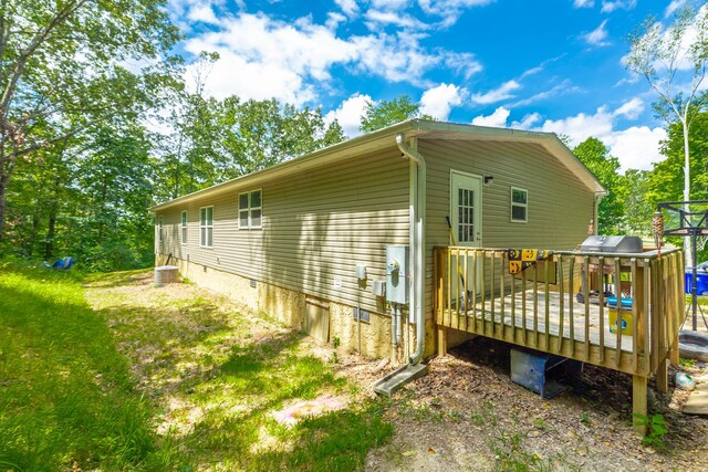 view of home's exterior featuring a deck