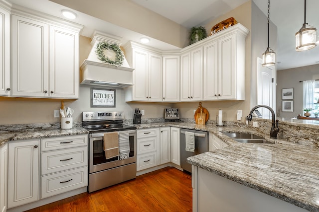 kitchen featuring dark hardwood / wood-style floors, sink, appliances with stainless steel finishes, and white cabinets