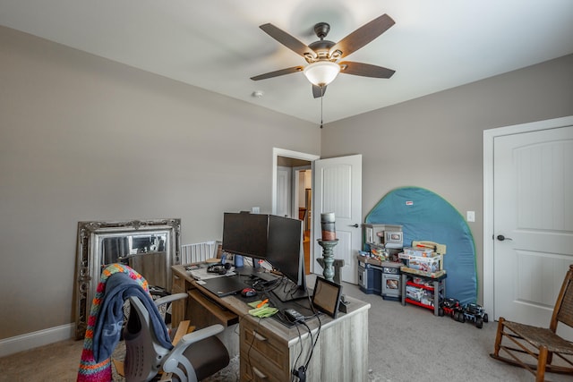 office area with ceiling fan and light colored carpet