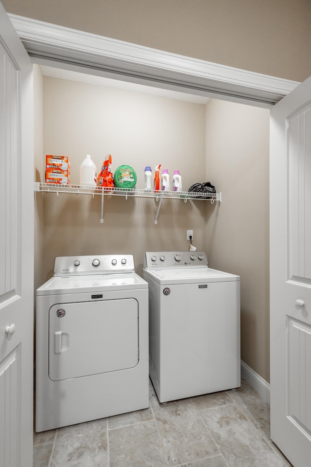 laundry room with separate washer and dryer