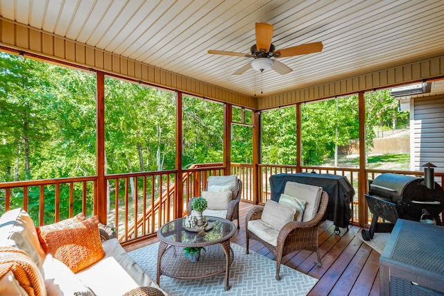 sunroom with ceiling fan and a wealth of natural light