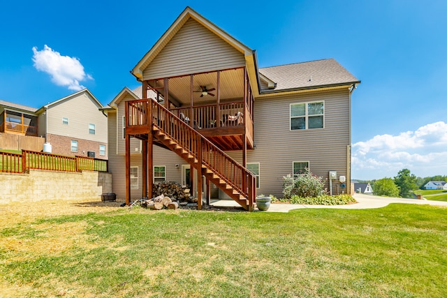 rear view of house with a yard and a deck