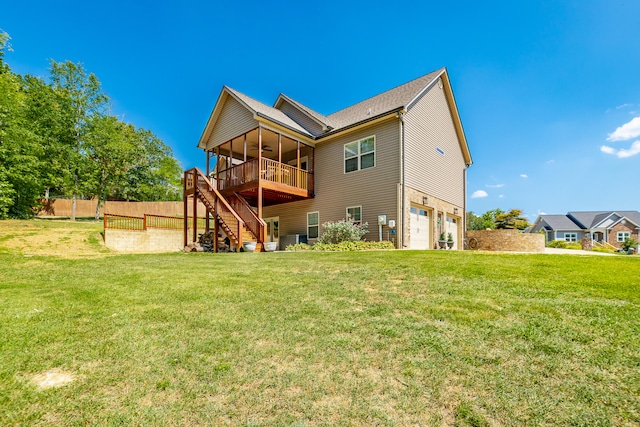 back of property with a yard and a garage