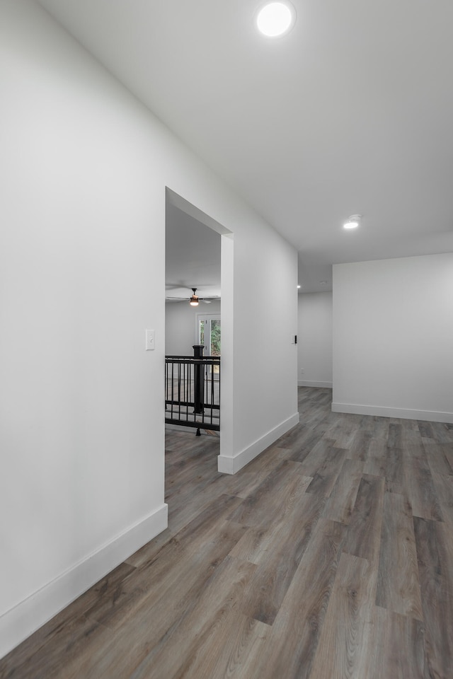 spare room featuring ceiling fan and hardwood / wood-style flooring