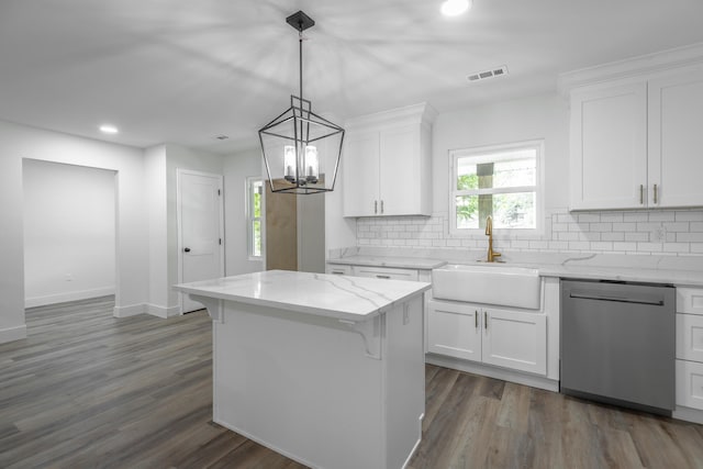 kitchen featuring dark hardwood / wood-style flooring, a notable chandelier, stainless steel dishwasher, sink, and white cabinetry