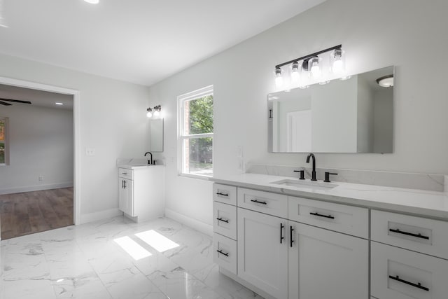 bathroom with vanity and ceiling fan