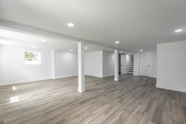 basement with wood-type flooring