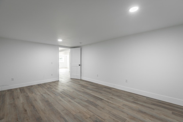 empty room with wood-type flooring