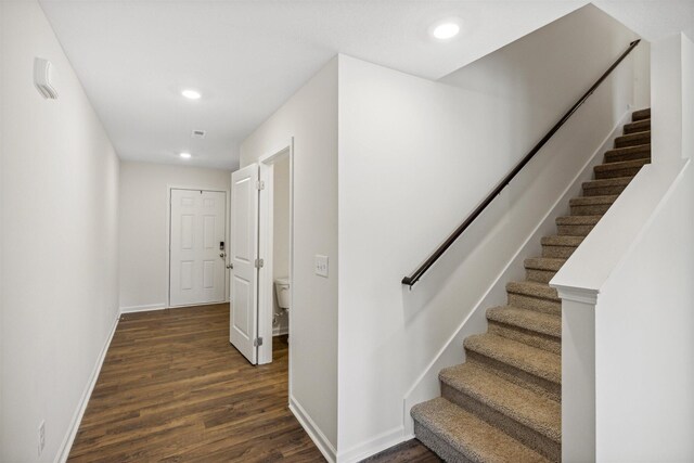 staircase featuring hardwood / wood-style flooring