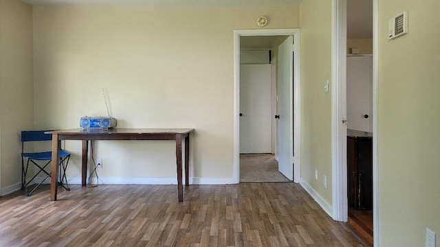 unfurnished room featuring hardwood / wood-style flooring