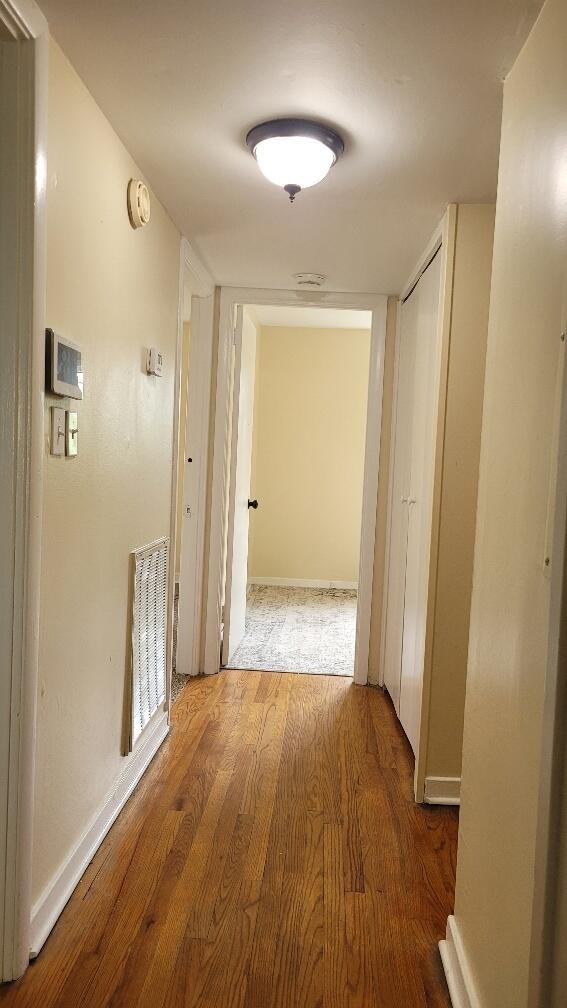 hallway featuring hardwood / wood-style floors