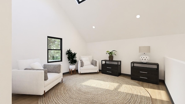 living area with light hardwood / wood-style floors and high vaulted ceiling