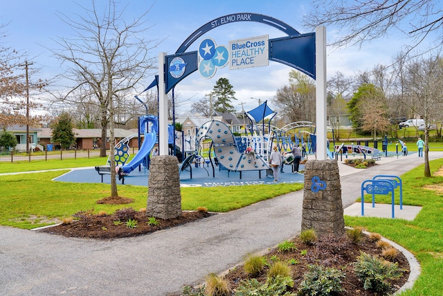 surrounding community featuring a playground and a yard