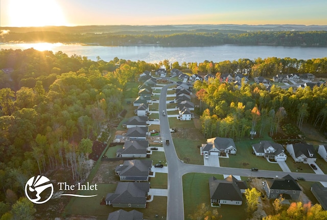 aerial view at dusk with a water view