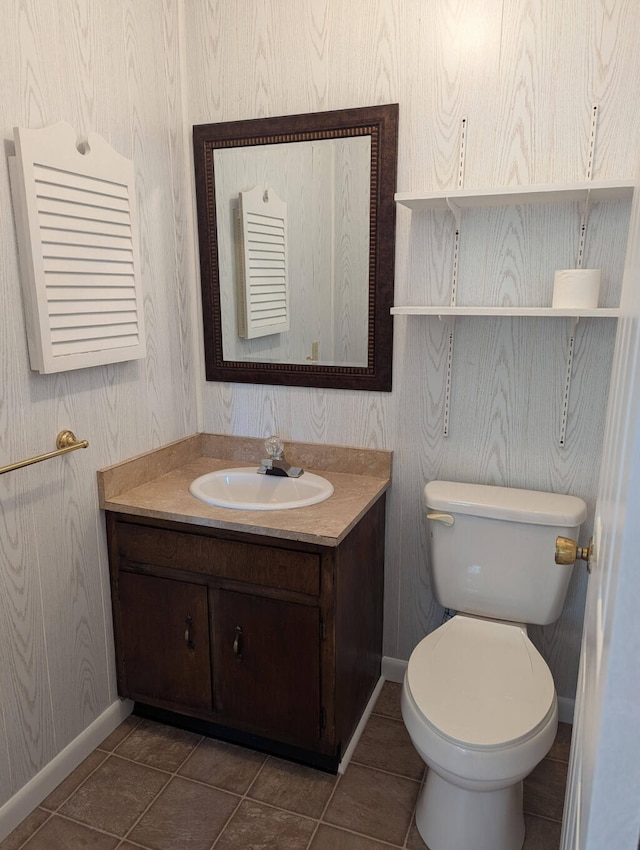 bathroom with tile patterned floors, toilet, and vanity