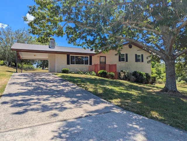 single story home featuring a carport and a front lawn