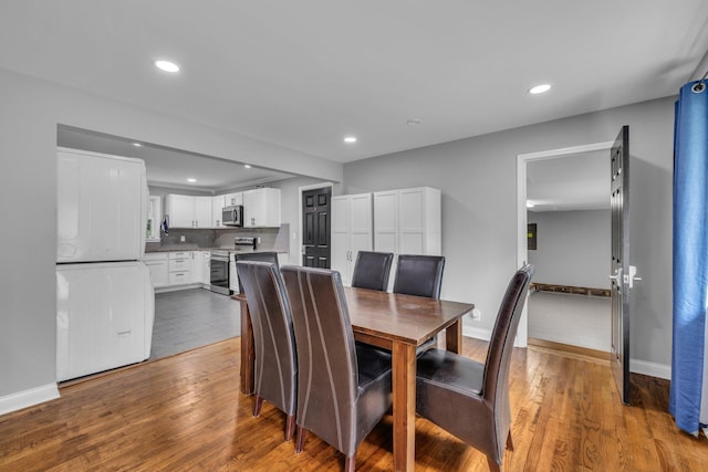 dining space featuring hardwood / wood-style floors