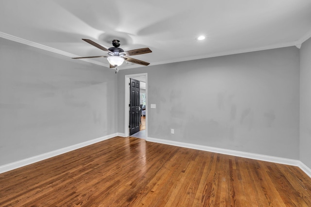 spare room featuring hardwood / wood-style floors, ceiling fan, and ornamental molding