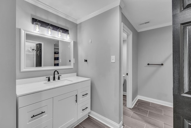 bathroom with vanity and crown molding