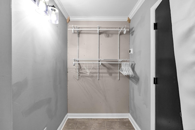 walk in closet with tile patterned flooring