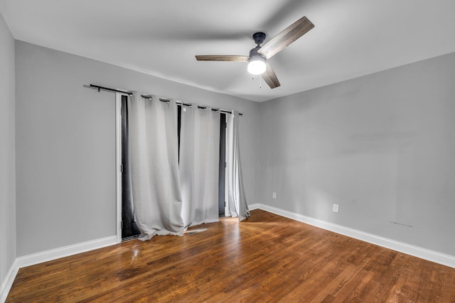 empty room featuring hardwood / wood-style flooring and ceiling fan