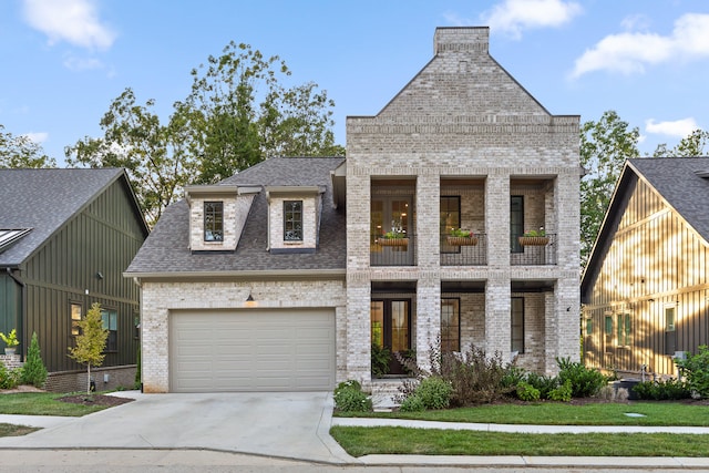 view of front of property featuring a balcony and a front lawn