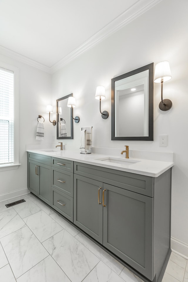 bathroom with crown molding and vanity