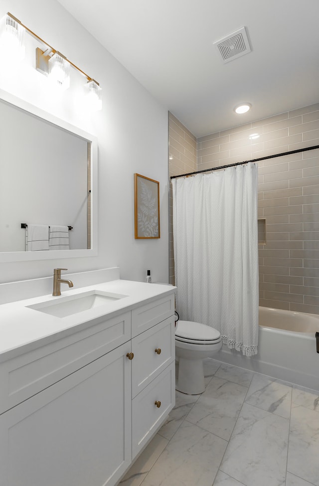 full bathroom with vanity, toilet, and shower / tub combo