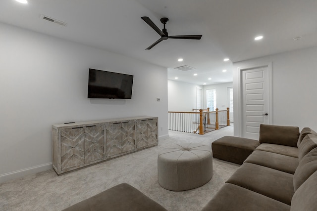 living room with light colored carpet and ceiling fan