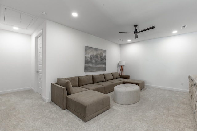 living room with light colored carpet and ceiling fan