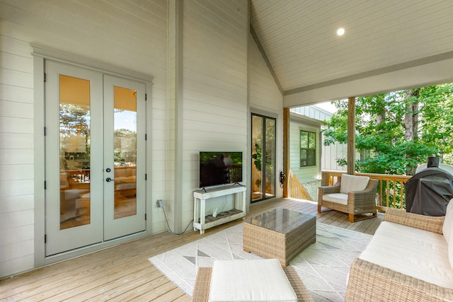 wooden deck featuring grilling area and french doors