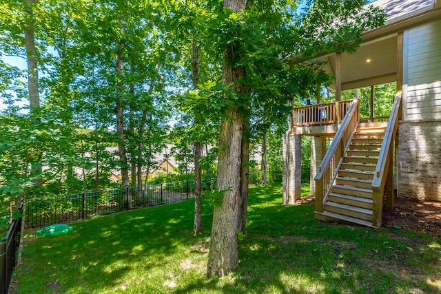 view of yard with a wooden deck