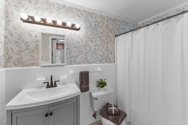 bathroom with toilet, ornamental molding, vanity, backsplash, and tile walls