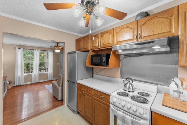 kitchen with white range with electric cooktop, light hardwood / wood-style floors, stainless steel refrigerator, ceiling fan, and a textured ceiling