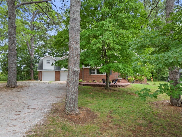 view of front of home featuring a garage and a front lawn