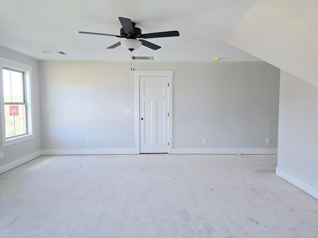 additional living space featuring ceiling fan