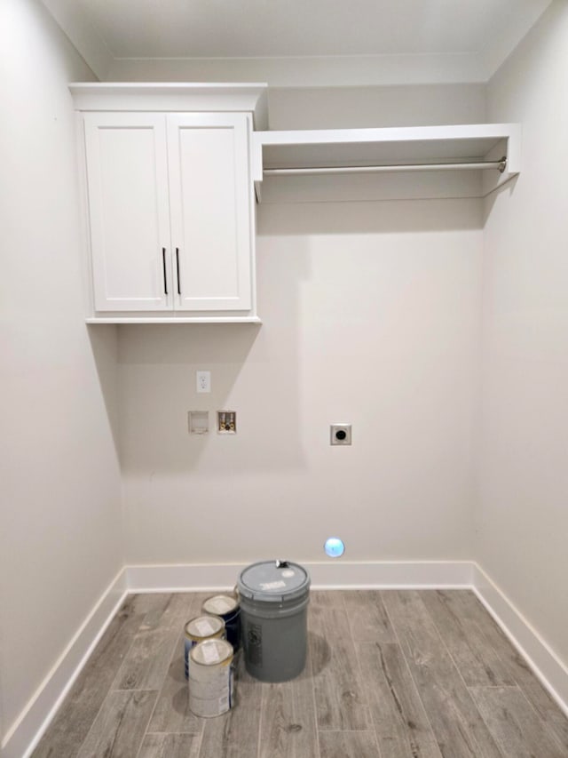 washroom featuring electric dryer hookup, hardwood / wood-style floors, and washer hookup