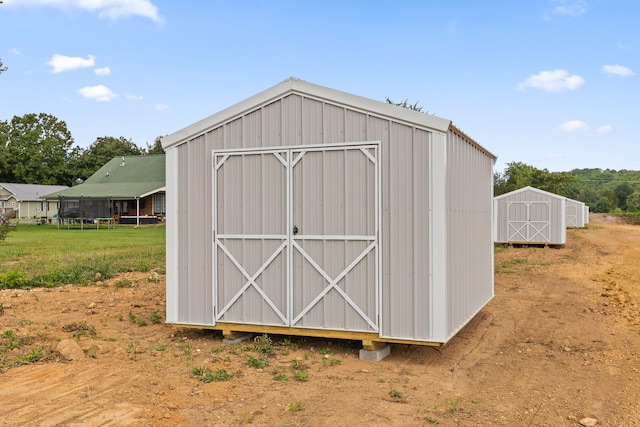 view of outbuilding with a lawn