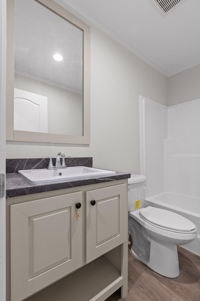 full bathroom featuring shower / bathing tub combination, vanity, toilet, and wood-type flooring