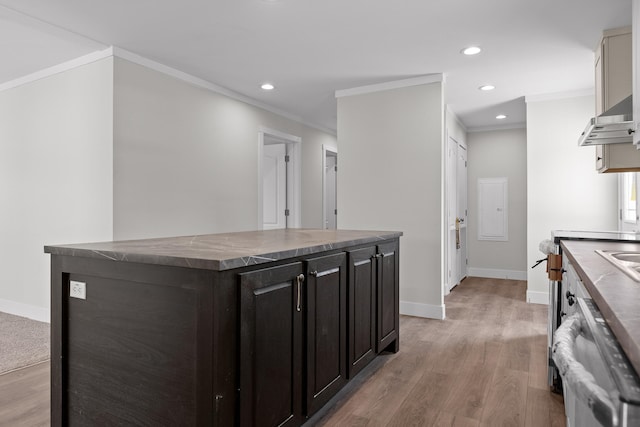 kitchen with a center island, light hardwood / wood-style floors, ornamental molding, dark brown cabinets, and dishwasher